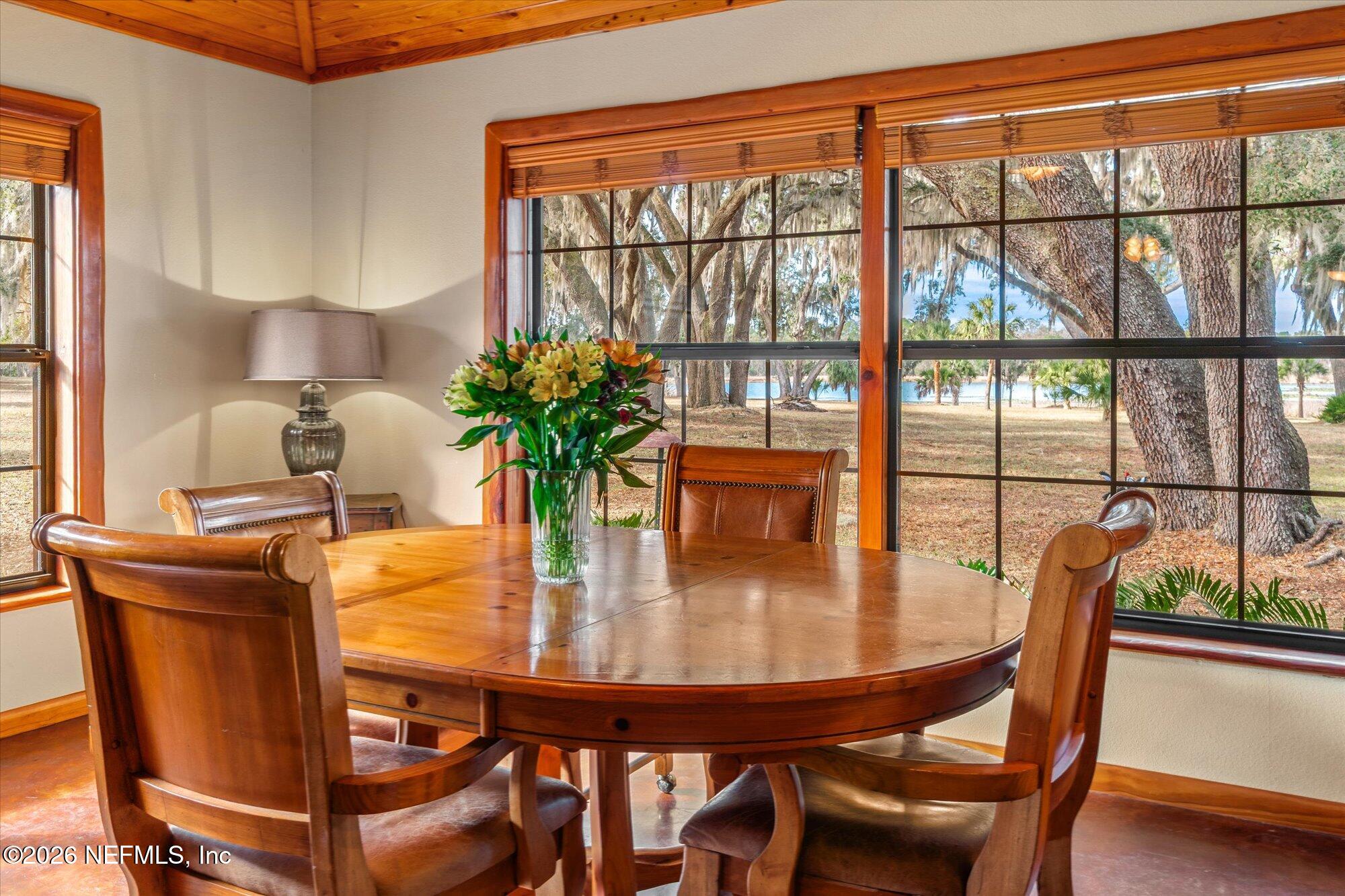 118 Hooks Lake Road Melrose, FL 32666 - Photo 16 of 61 a dining room with furniture and window
