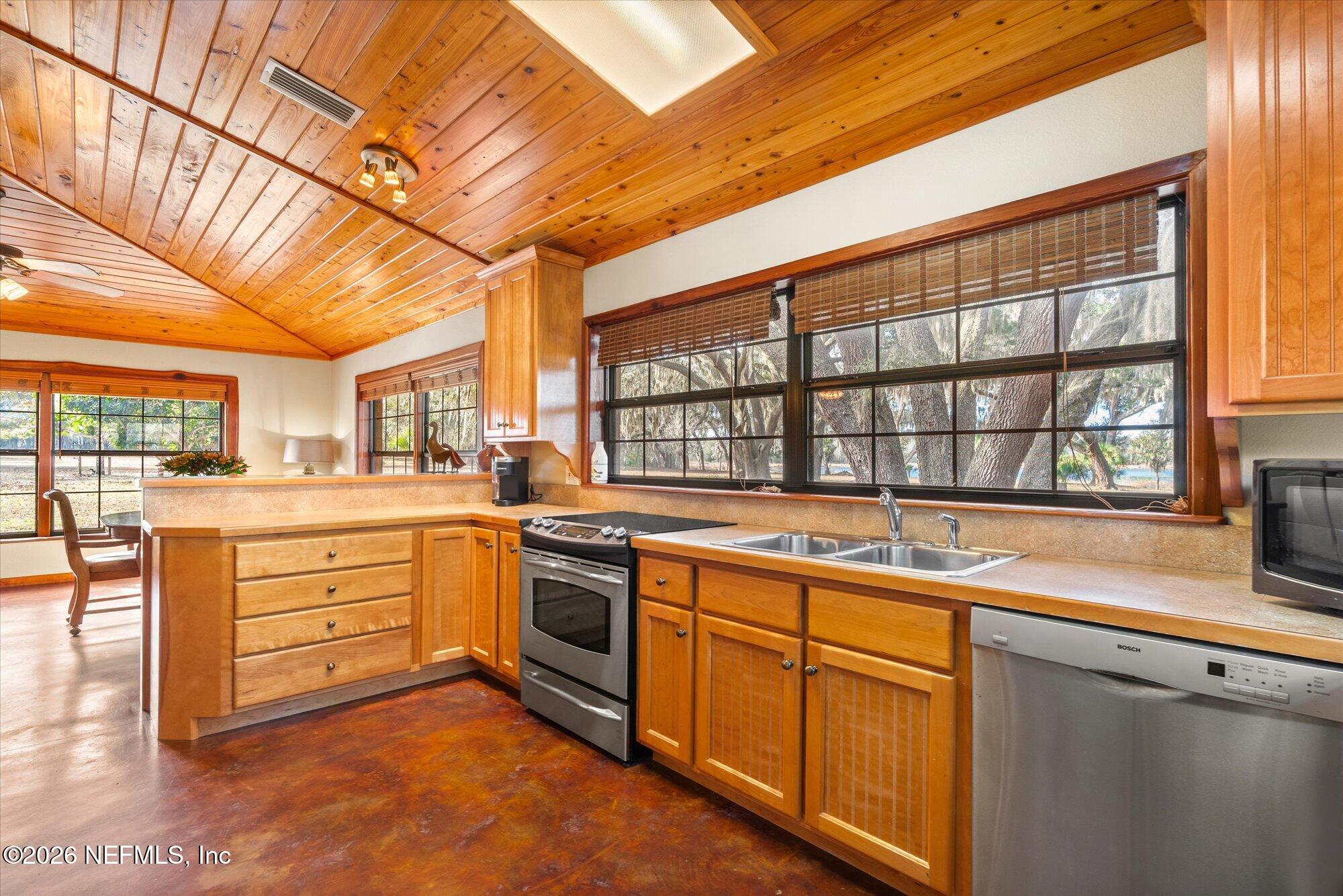 118 Hooks Lake Road Melrose, FL 32666 - Photo 20 of 61 a open kitchen with stainless steel appliances granite countertop a stove and cabinets