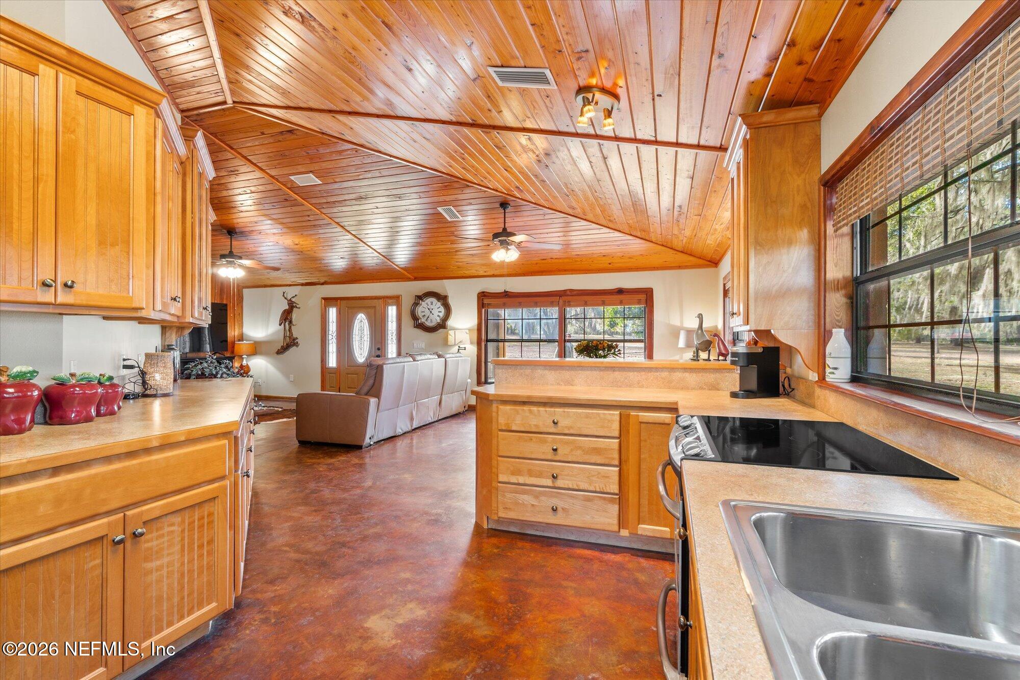 118 Hooks Lake Road Melrose, FL 32666 - Photo 21 of 61 a kitchen that has a lot of cabinets in it