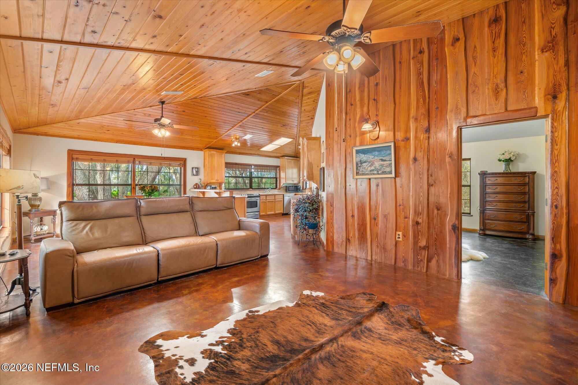 118 Hooks Lake Road Melrose, FL 32666 - Photo 24 of 61 a living room with furniture a wooden floor and a window