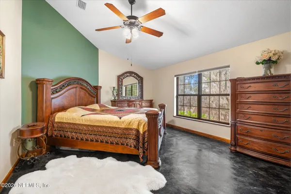 a bedroom with a bed and a cabinets