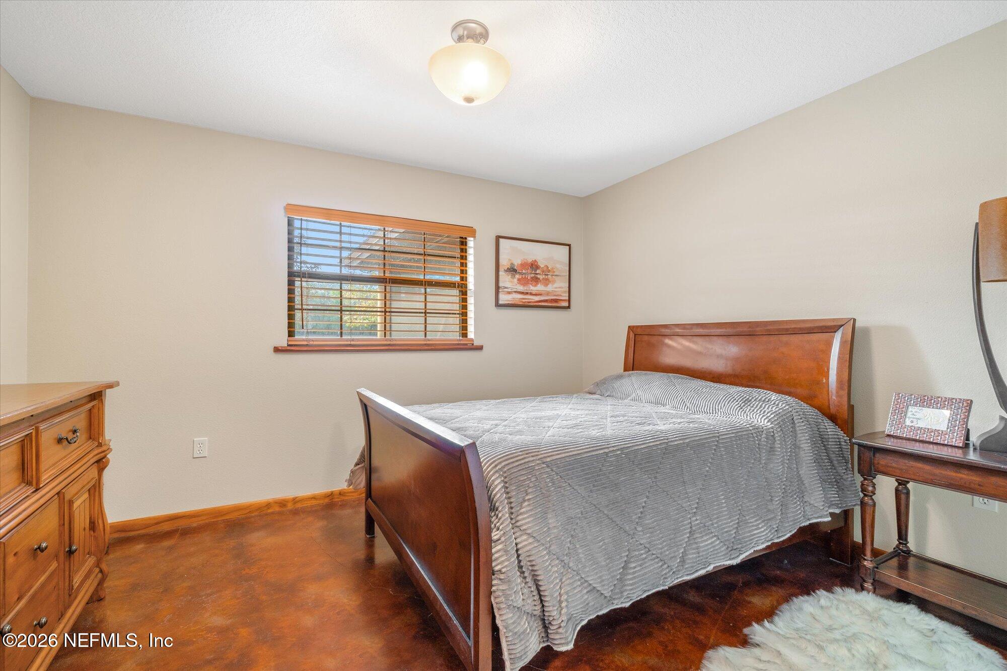 118 Hooks Lake Road Melrose, FL 32666 - Photo 30 of 61 a bedroom with a bed and a cabinets