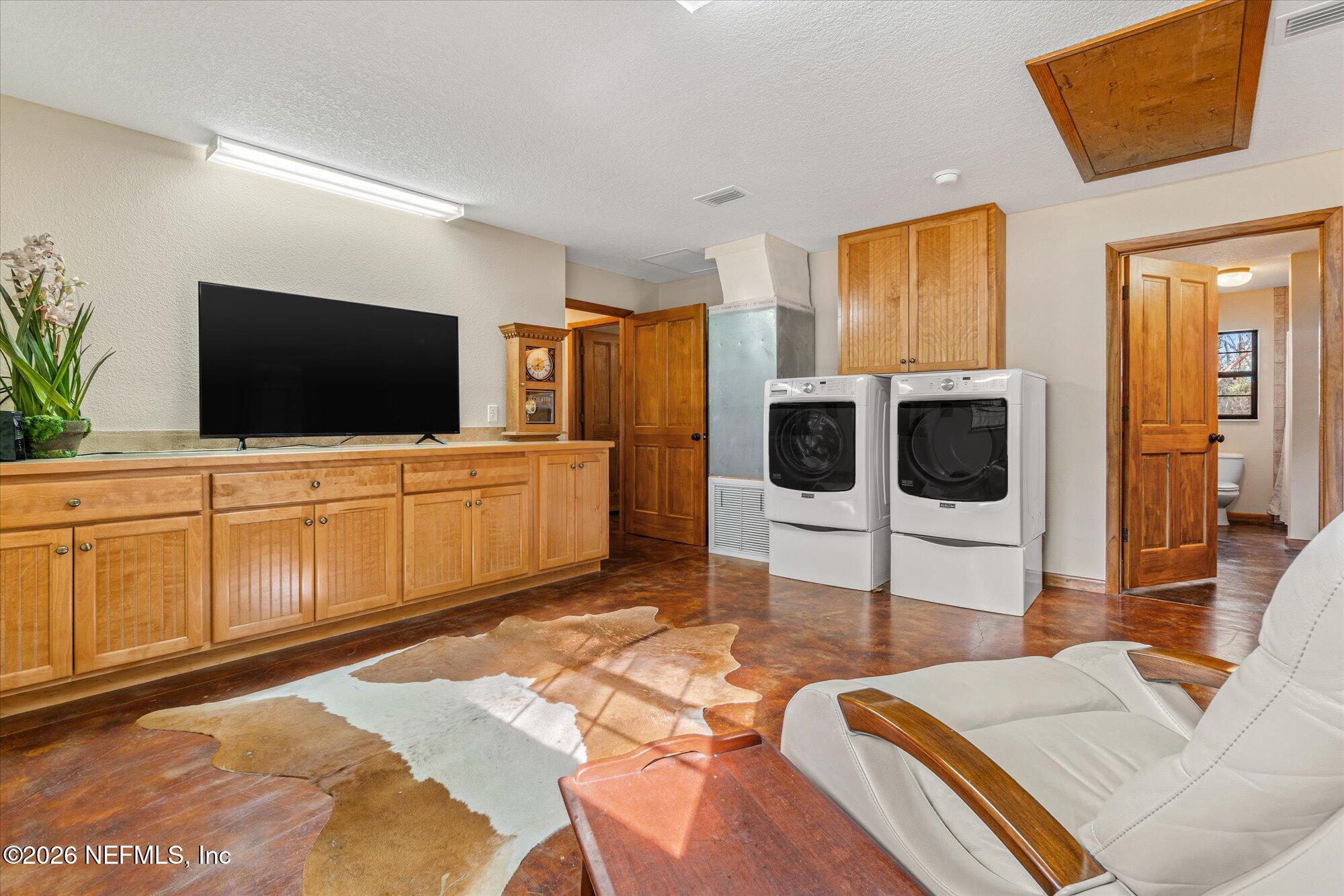 118 Hooks Lake Road Melrose, FL 32666 - Photo 36 of 61 a view of a livingroom with furniture and a flat screen tv
