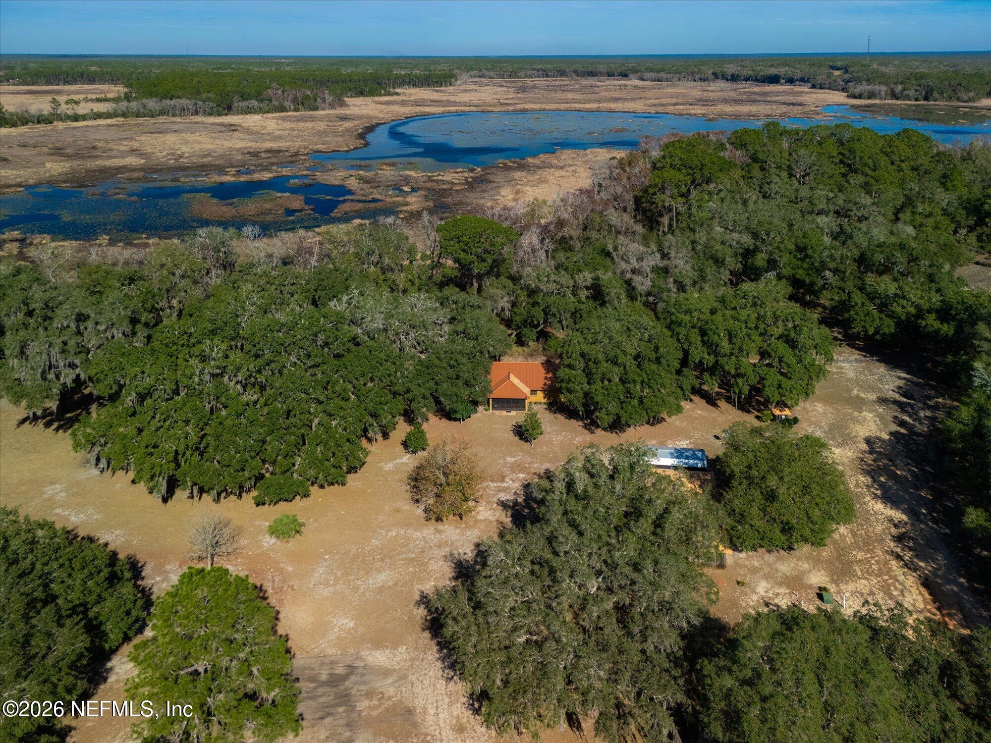 118 Hooks Lake Road Melrose, FL 32666 - Photo 56 of 61 an aerial view of ocean with residential house and outdoor space