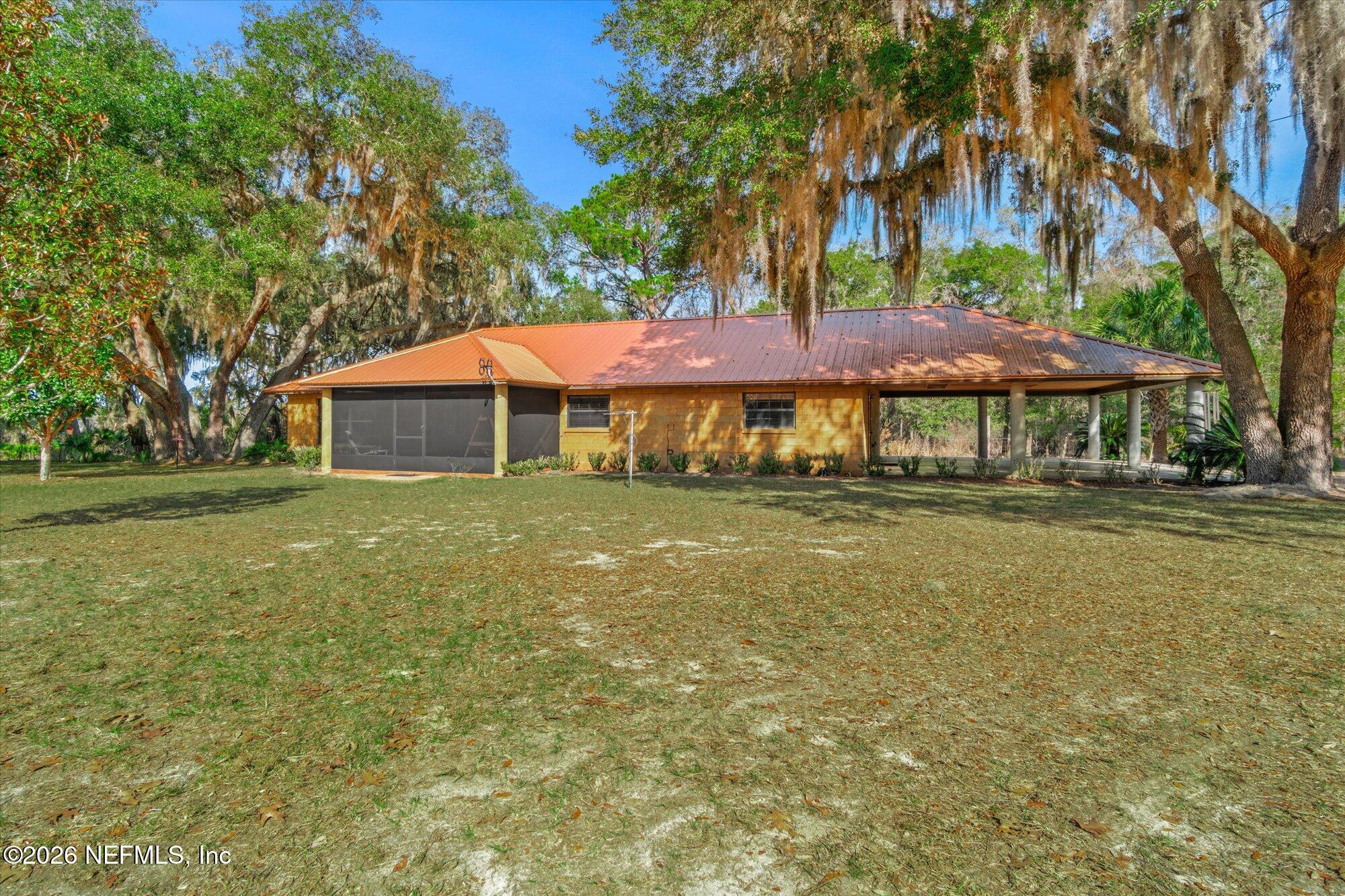 118 Hooks Lake Road Melrose, FL 32666 - Photo 6 of 61 a house with swimming pool in front of it