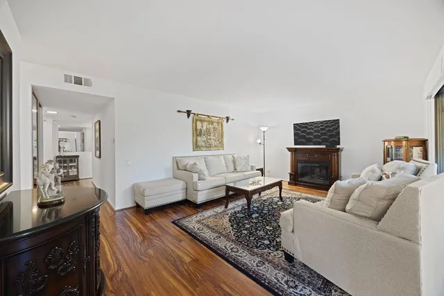a kitchen with stainless steel appliances granite countertop a sink stove and microwave