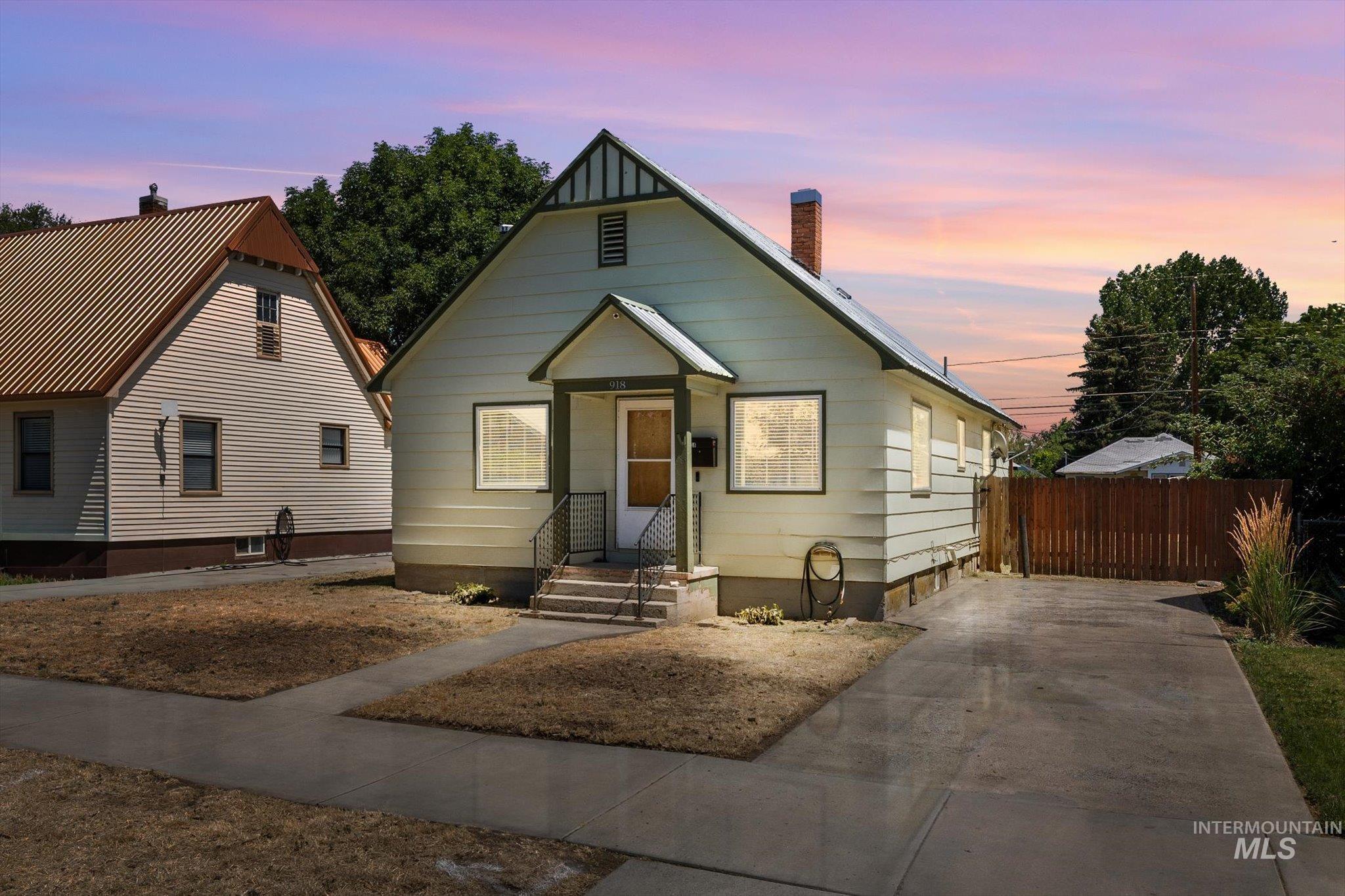 918 West 3rd Street Weiser, ID 83672 - Photo 1 of 36 Gable-front home featuring light-colored siding and a covered entry