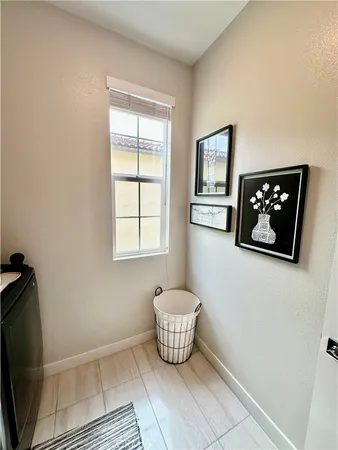 a room with wooden floor and a window