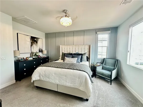 a bedroom with a bed and a couch