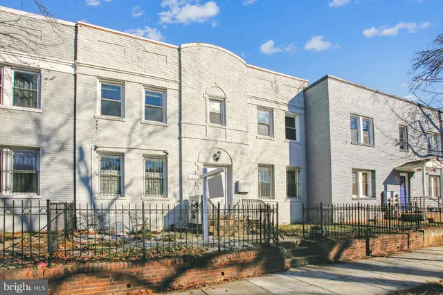 a front view of a building with lot of windows