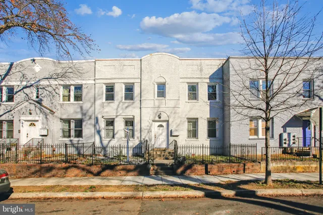 a front view of a building with street view