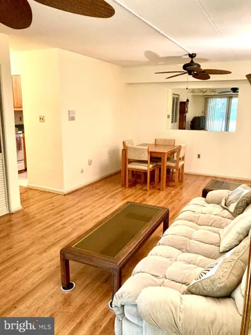 a view of a living room and kitchen