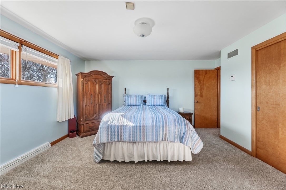 22814 Buck Road Alliance, OH 44601 - Photo 5 of 17 Carpeted bedroom featuring baseboard heating