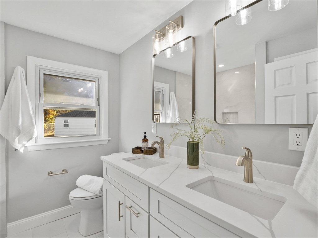 27 Hodgkins Road Rockport, MA 01966 - Photo 13 of 35 a bathroom with a toilet sink and mirror