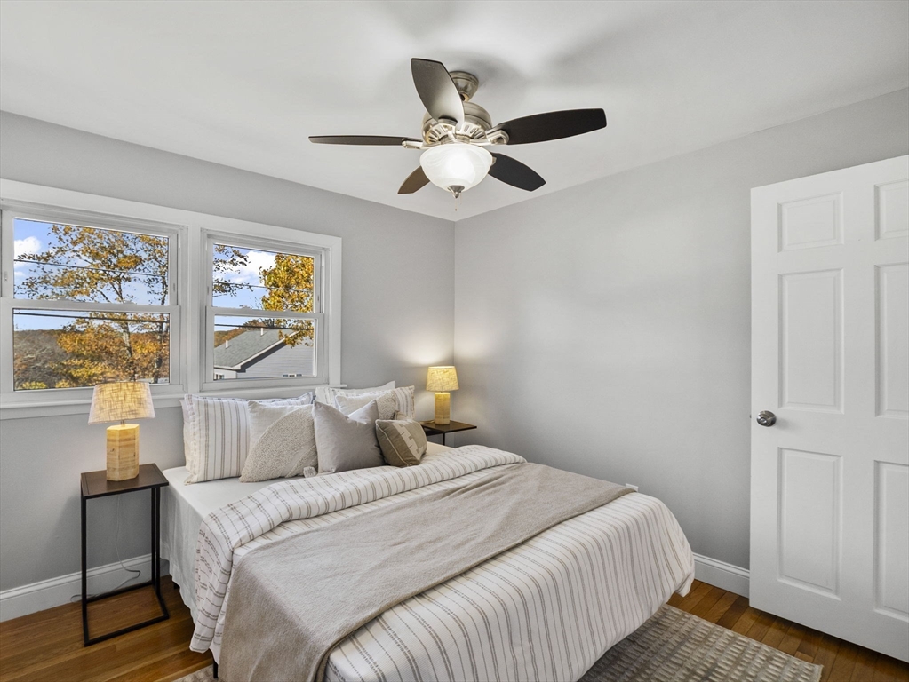 27 Hodgkins Road Rockport, MA 01966 - Photo 16 of 35 a bedroom with a bed and a window