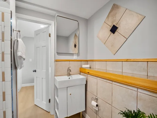 a bathroom with a sink and a mirror