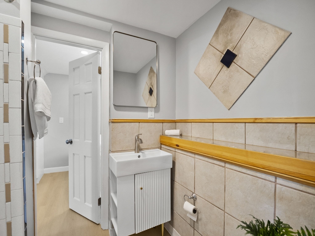 27 Hodgkins Road Rockport, MA 01966 - Photo 21 of 35 a bathroom with a sink and a mirror