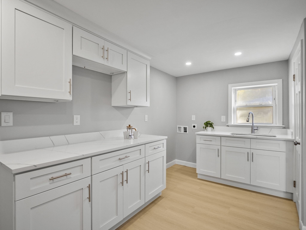 27 Hodgkins Road Rockport, MA 01966 - Photo 23 of 35 a kitchen with sink and cabinets