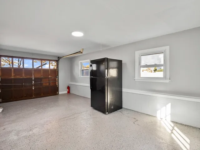 a view of an empty room with a fireplace
