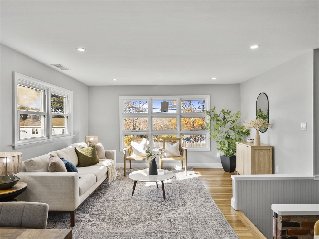 27 Hodgkins Road Rockport, MA 01966 - Photo 9 of 35 a living room with furniture and a large window