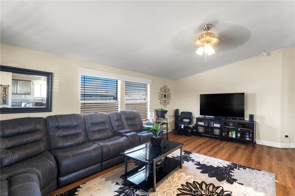 22241 Nisqually Road, Unit 103 Apple Valley, CA 92308 - Photo 6 of 34 Spacious living room with large sectional and natural light