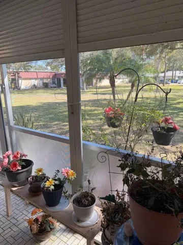 a table with a vase and flowers on it