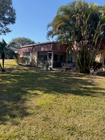 a view of a house with a yard