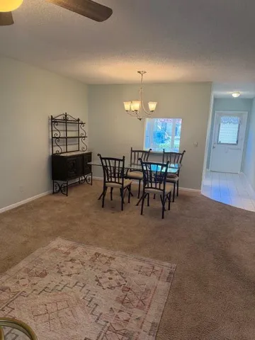 a view of a dining room with furniture