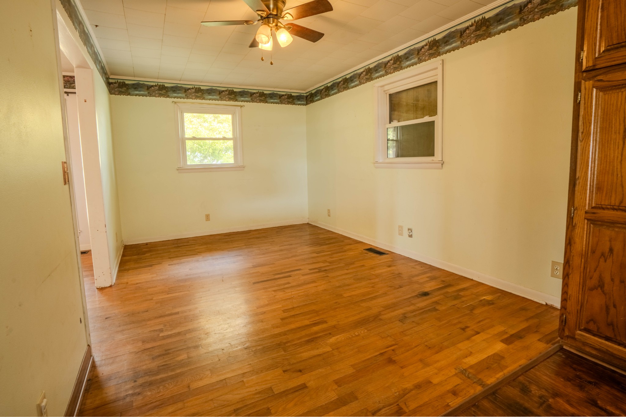 97 Ramah Road Leoma, TN 38468 - Photo 11 of 43 a view of empty room with wooden floor and fan