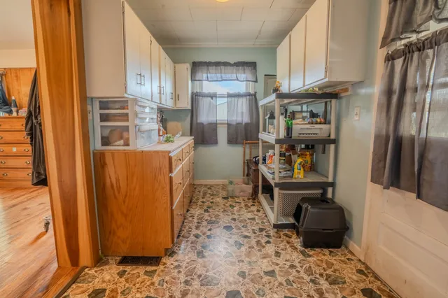 a kitchen with stainless steel appliances granite countertop a refrigerator and a stove