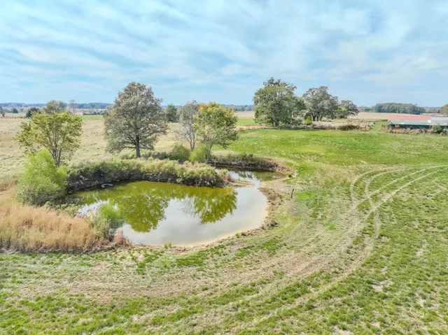 a view of a lake with a yard