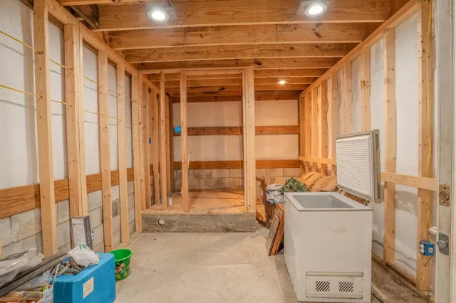 a bathroom with a shower and a glass door