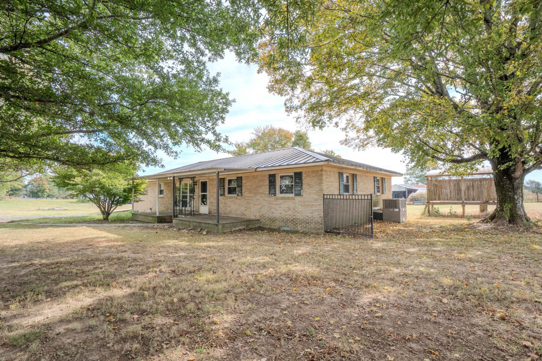 97 Ramah Road Leoma, TN 38468 - Photo 6 of 43 a front view of a house with a garden