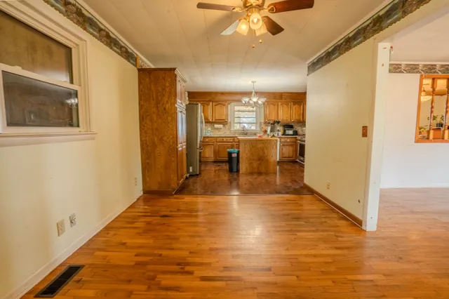 a view of a living room with kitchen view
