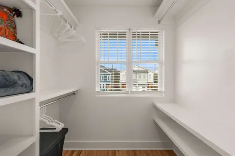 a bathroom with a tub and a window