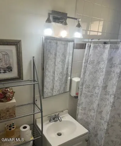 a bathroom with a sink and mirror