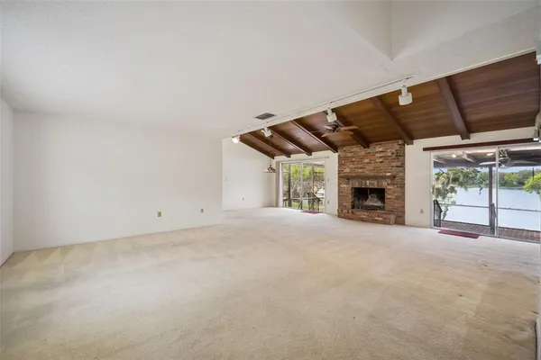 a view of an empty room with a sliding door