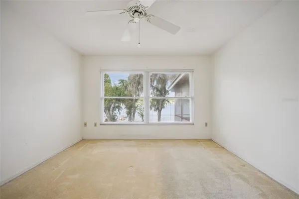 a view of an empty room with a window