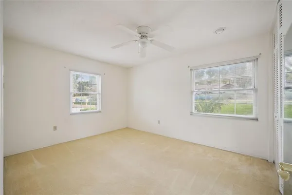 a big yard with swimming pool and green space