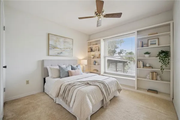a room with furniture pool table wooden floor and windows