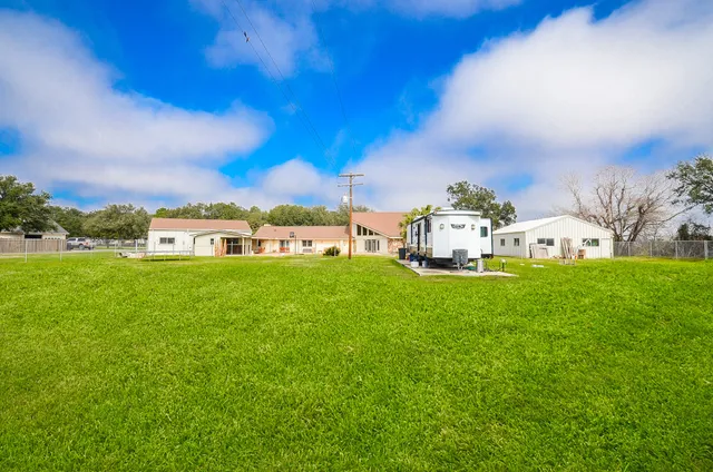 a view of a house with a big yard