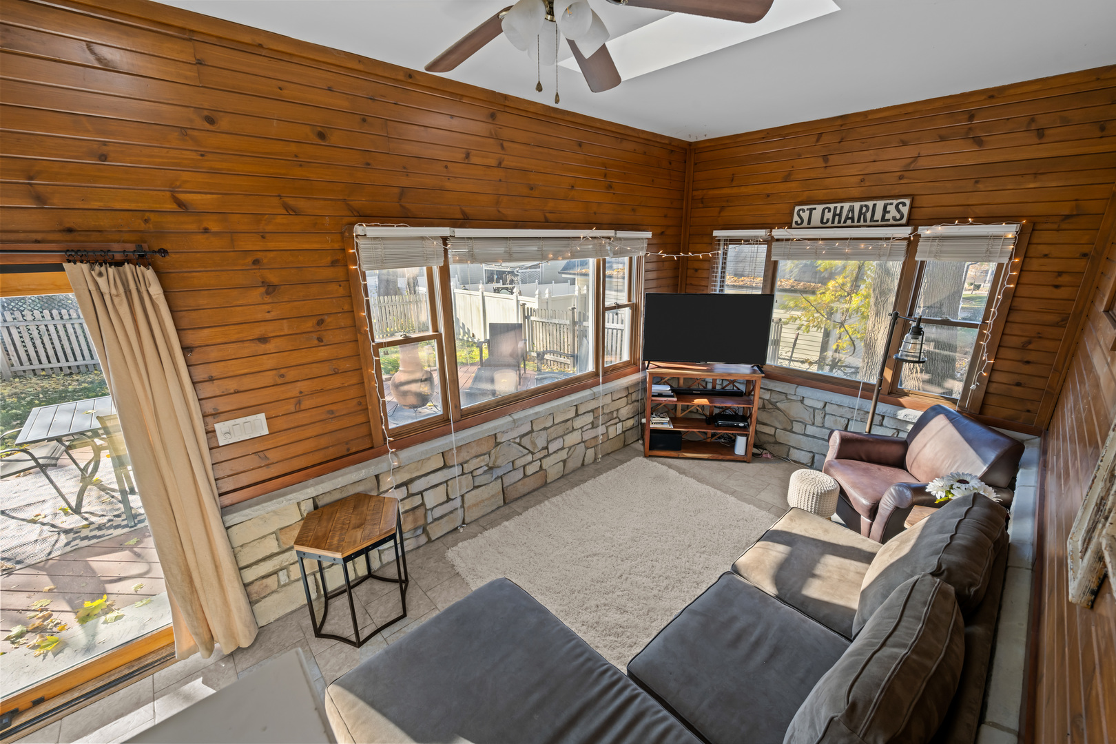 311 Ohio Avenue St. Charles, IL 60174 - Photo 12 of 20 a living room with furniture and a flat screen tv