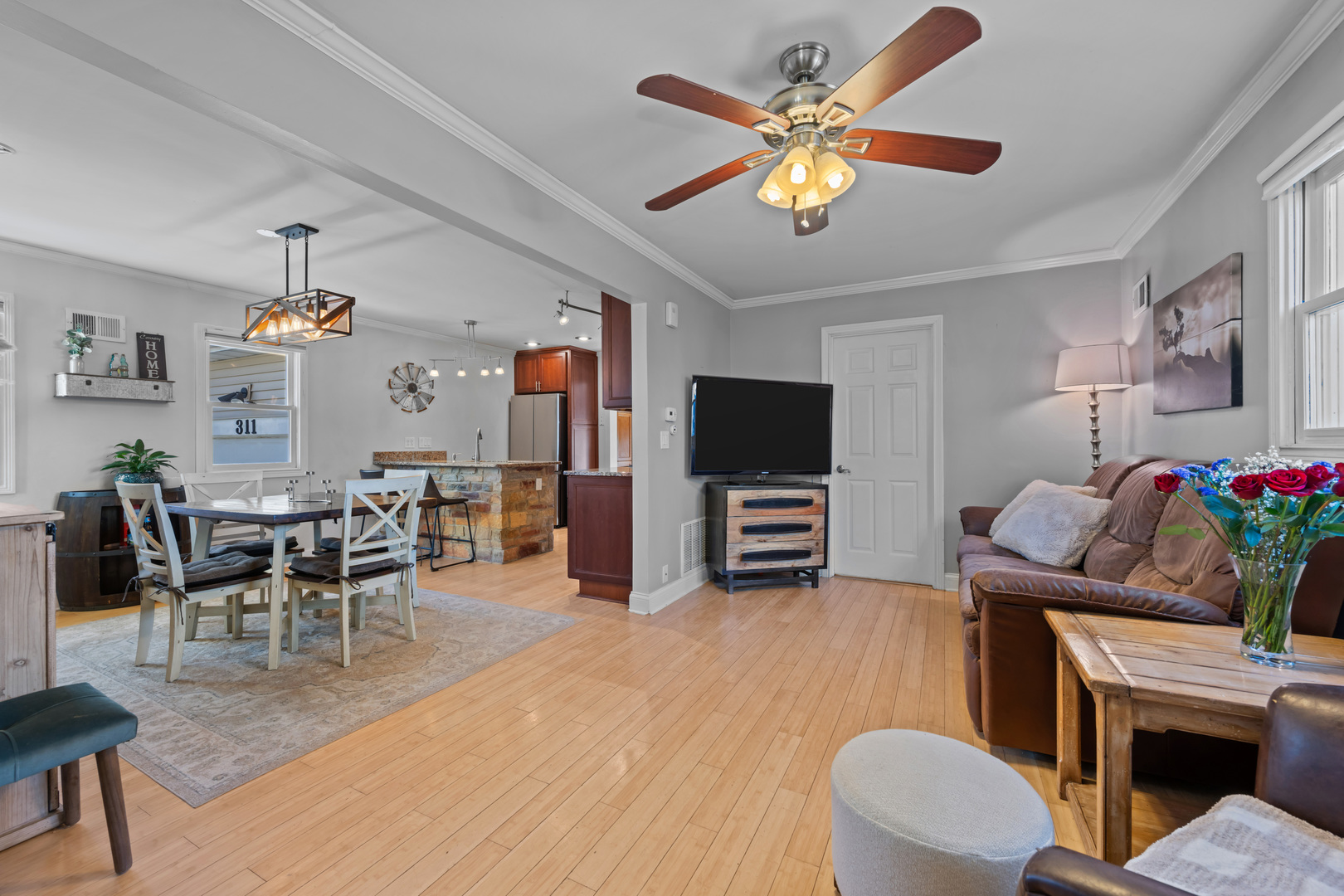 311 Ohio Avenue St. Charles, IL 60174 - Photo 3 of 20 a living room with furniture and a flat screen tv