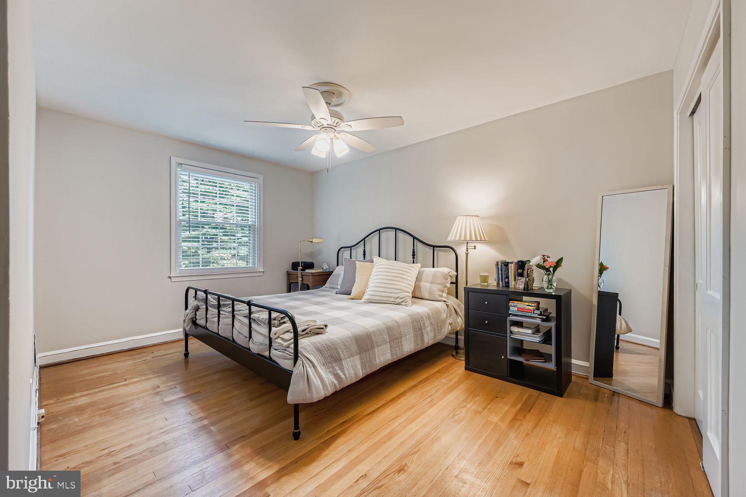 1552 Cottage Lane Towson, MD 21286 - Photo 14 of 32 a bedroom with a bed and a window