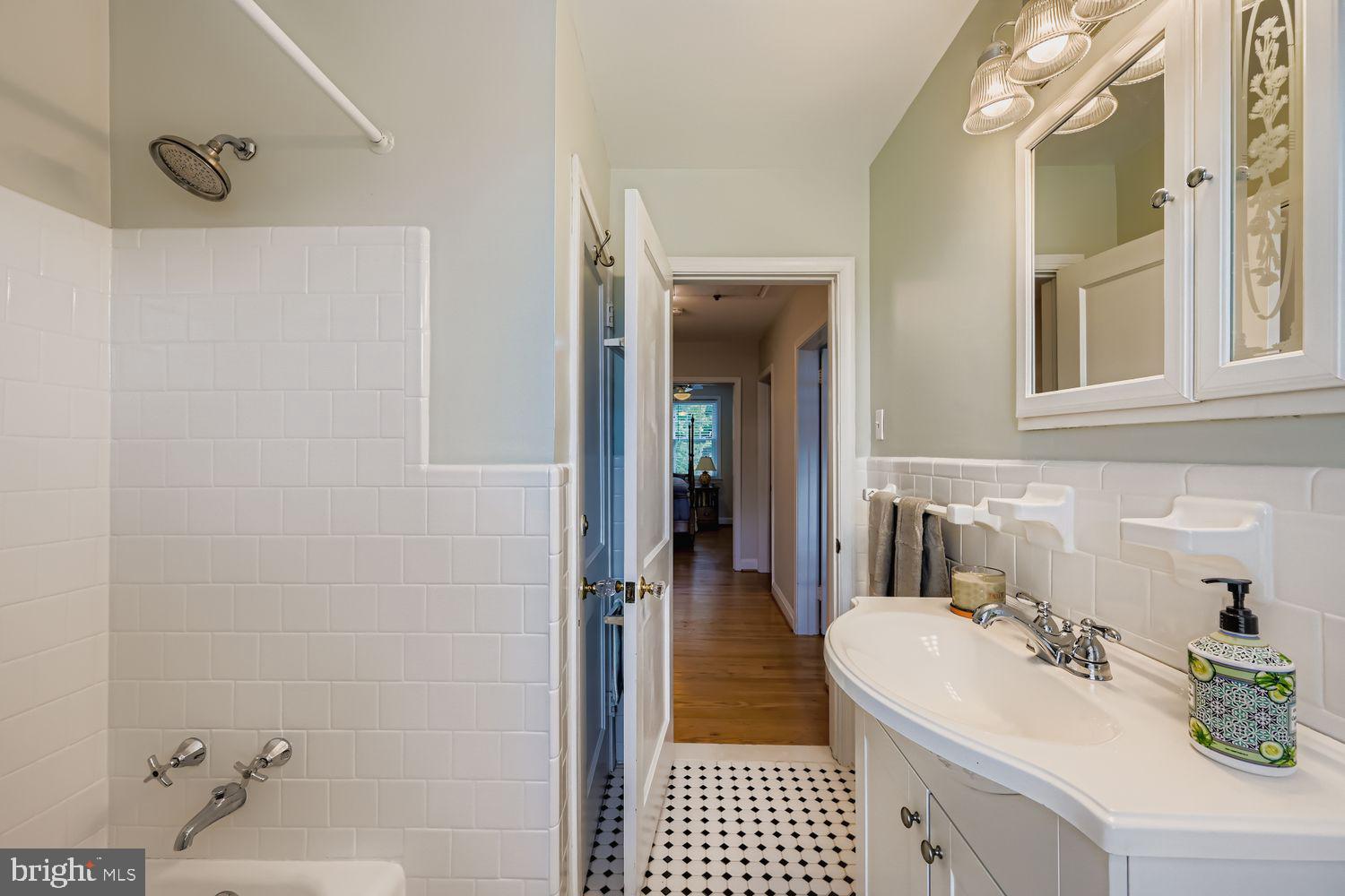 1552 Cottage Lane Towson, MD 21286 - Photo 17 of 32 a bathroom with a sink and a mirror