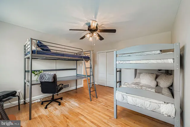 a room with gym equipment and a chandelier