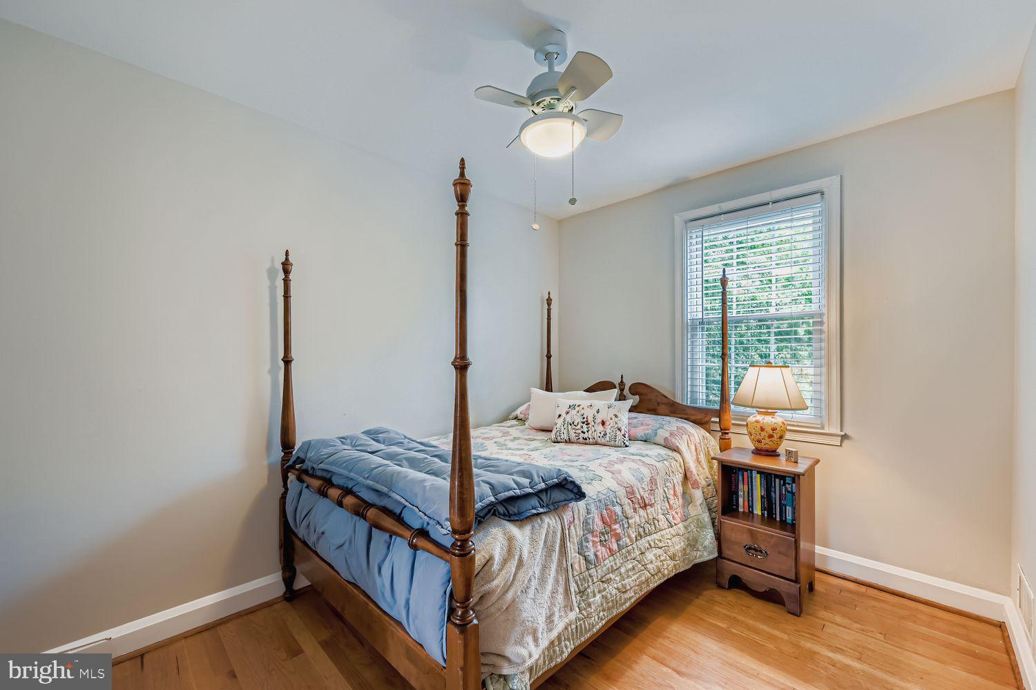 1552 Cottage Lane Towson, MD 21286 - Photo 20 of 32 a bedroom with a bed and a chandelier