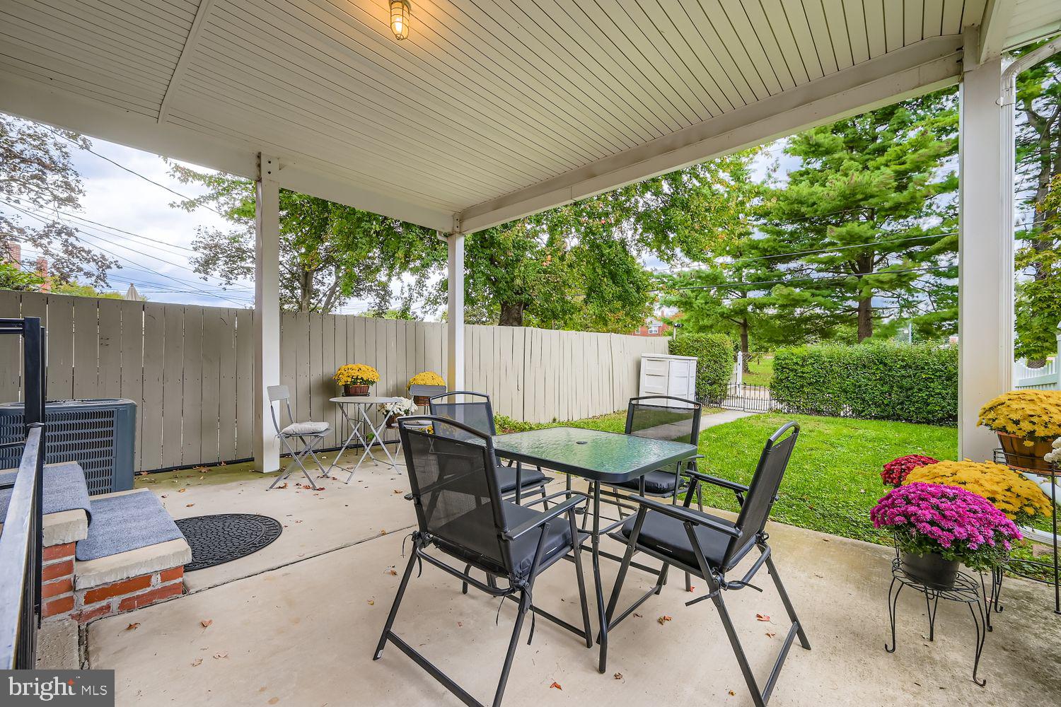 1552 Cottage Lane Towson, MD 21286 - Photo 27 of 32 a view of a patio with a table chairs and a backyard