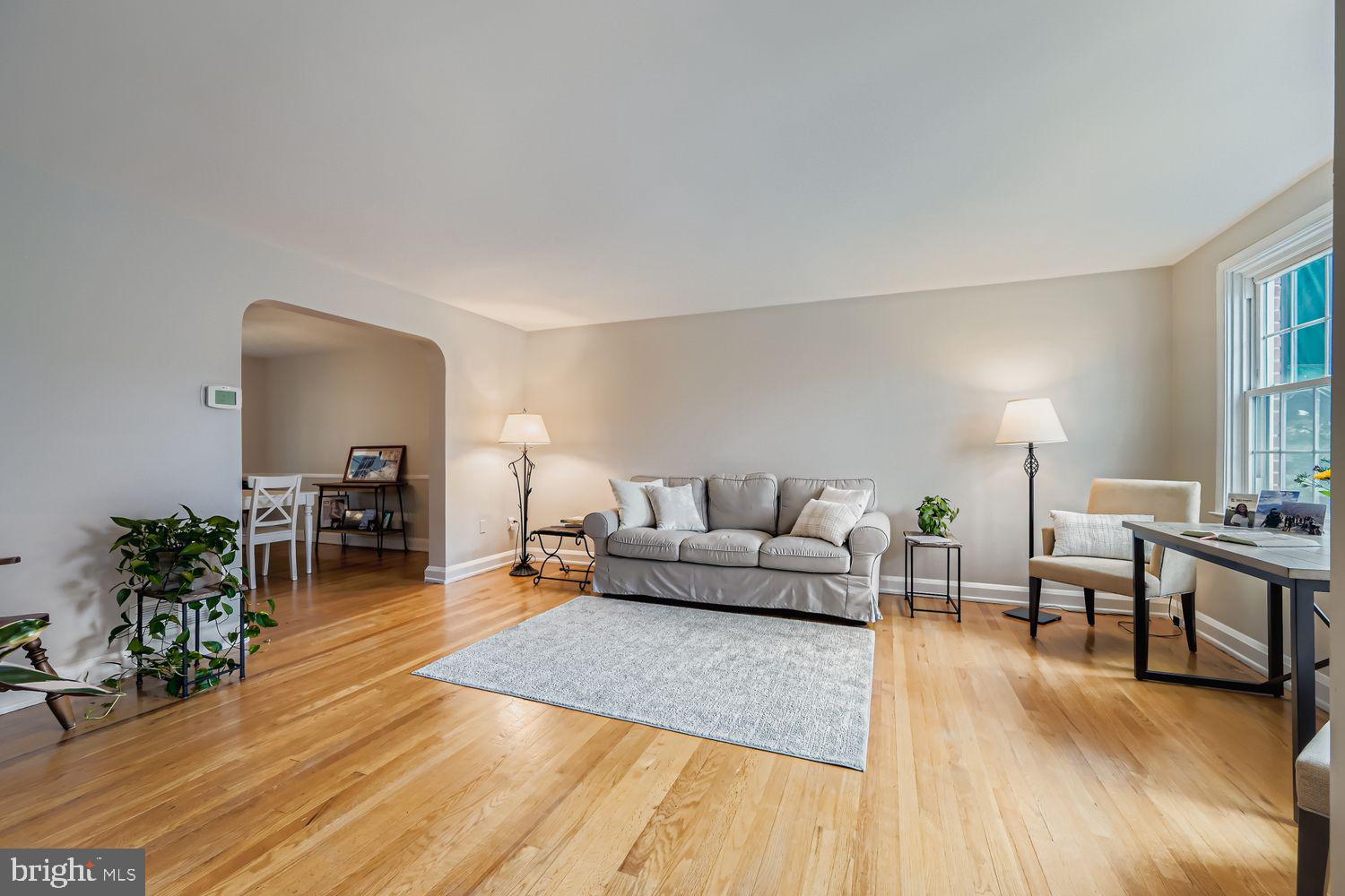 1552 Cottage Lane Towson, MD 21286 - Photo 6 of 32 a living room with furniture and a wooden floor