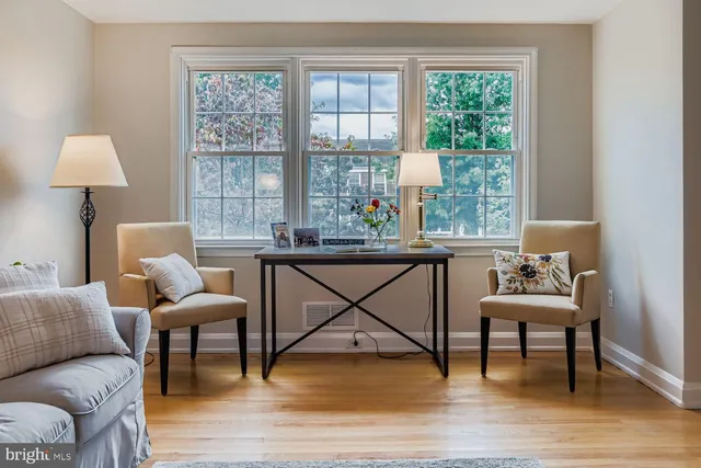 a living room with furniture and a table